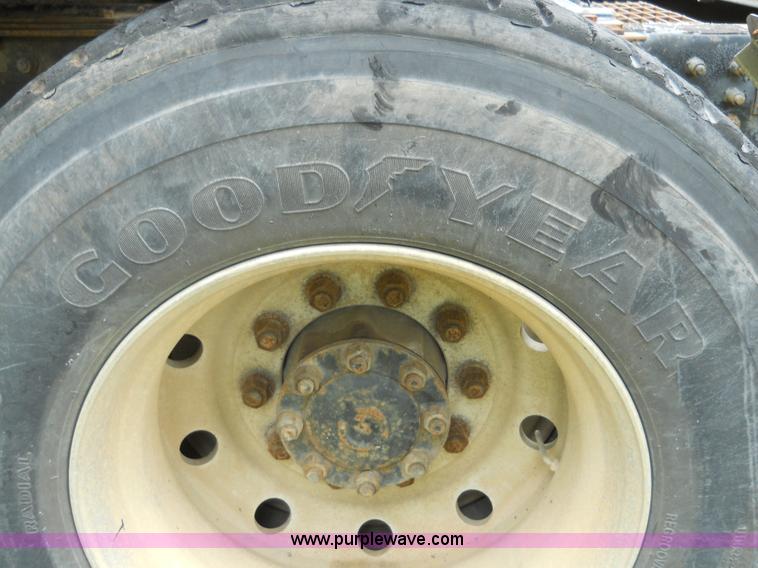 image for item 7872 1995 White GMC Aero WIA semi truck with triple axle trailer