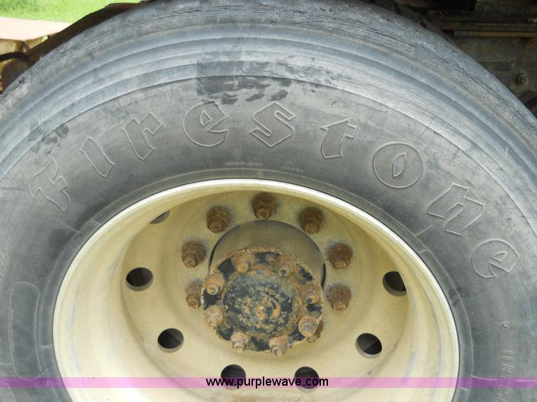 image for item 7872 1995 White GMC Aero WIA semi truck with triple axle trailer