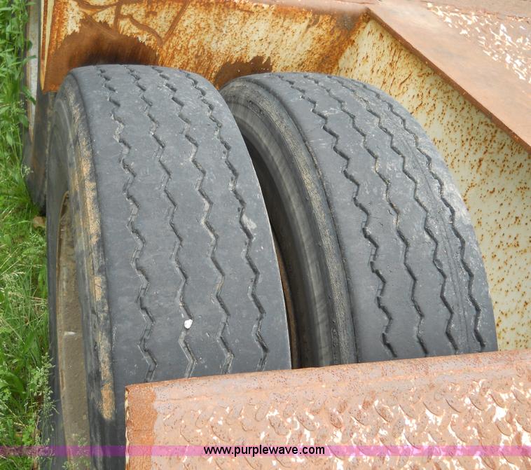 image for item 7872 1995 White GMC Aero WIA semi truck with triple axle trailer