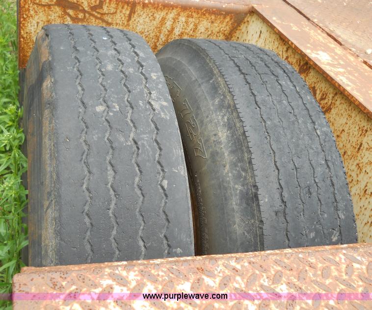 image for item 7872 1995 White GMC Aero WIA semi truck with triple axle trailer