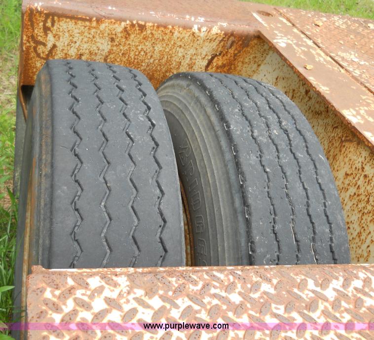 image for item 7872 1995 White GMC Aero WIA semi truck with triple axle trailer