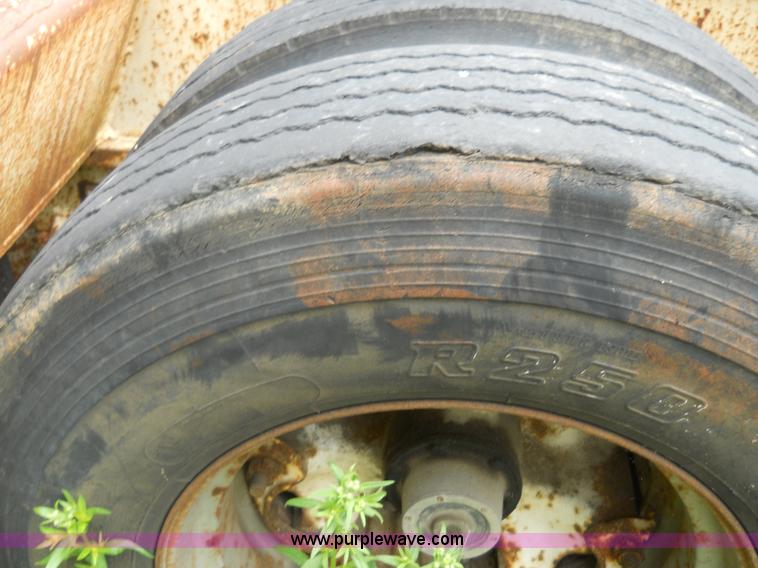 image for item 7872 1995 White GMC Aero WIA semi truck with triple axle trailer