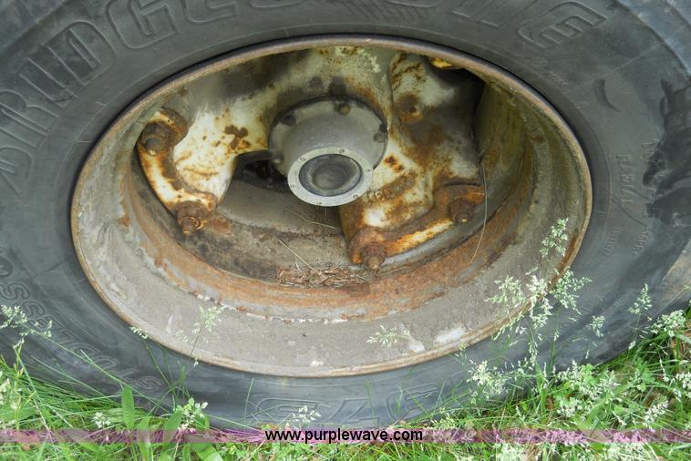 image for item 7872 1995 White GMC Aero WIA semi truck with triple axle trailer