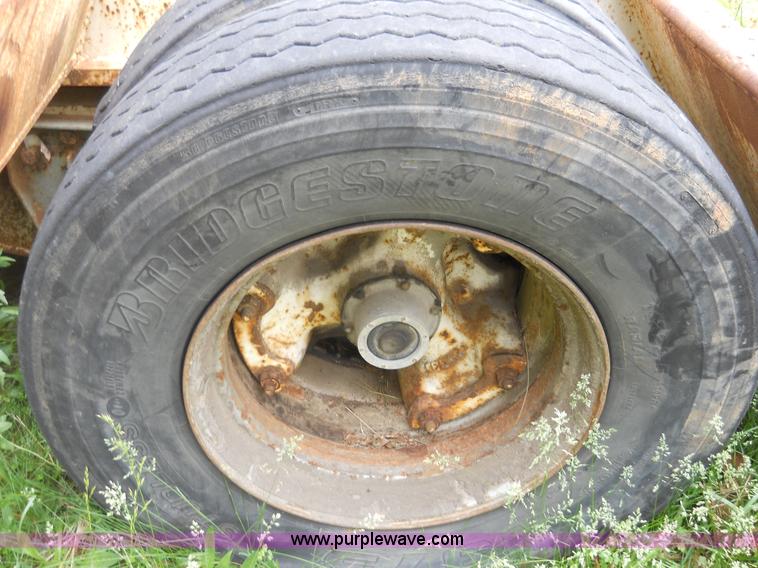 image for item 7872 1995 White GMC Aero WIA semi truck with triple axle trailer