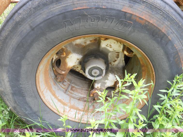 image for item 7872 1995 White GMC Aero WIA semi truck with triple axle trailer