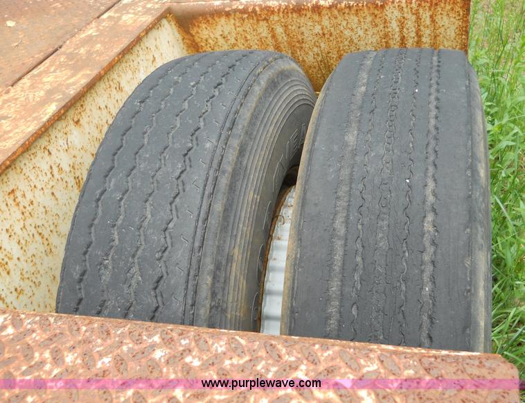 image for item 7872 1995 White GMC Aero WIA semi truck with triple axle trailer