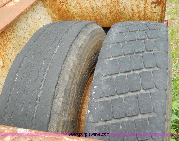 image for item 7872 1995 White GMC Aero WIA semi truck with triple axle trailer