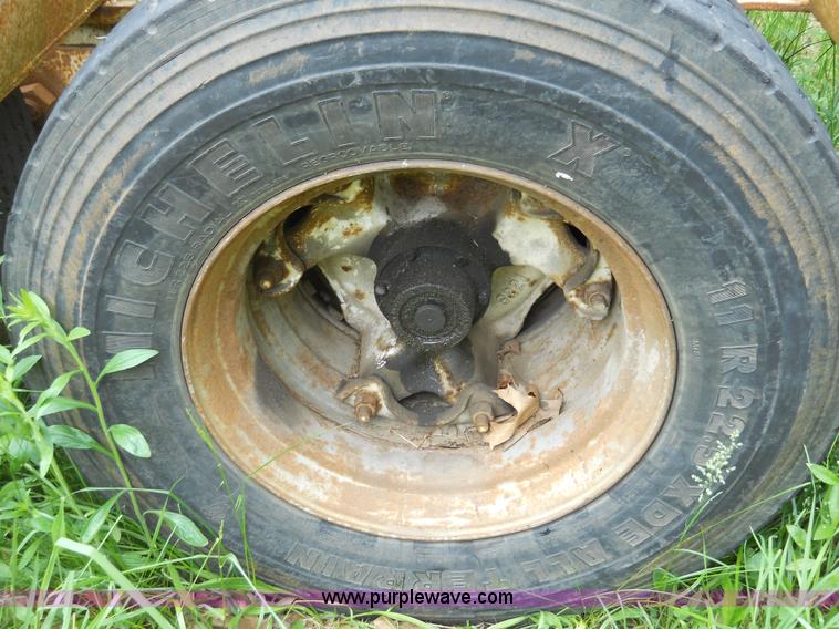 image for item 7872 1995 White GMC Aero WIA semi truck with triple axle trailer