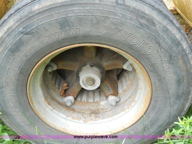 image for item 7872 1995 White GMC Aero WIA semi truck with triple axle trailer