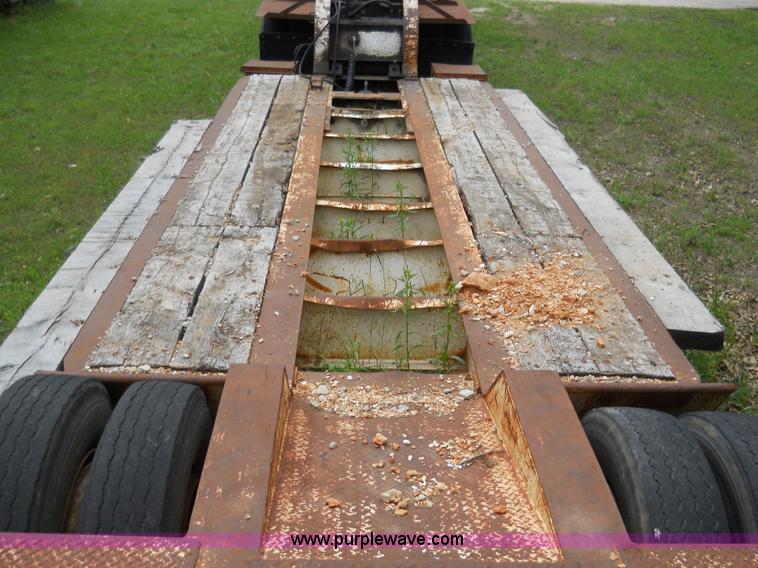 image for item 7872 1995 White GMC Aero WIA semi truck with triple axle trailer