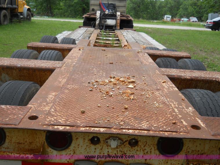 image for item 7872 1995 White GMC Aero WIA semi truck with triple axle trailer