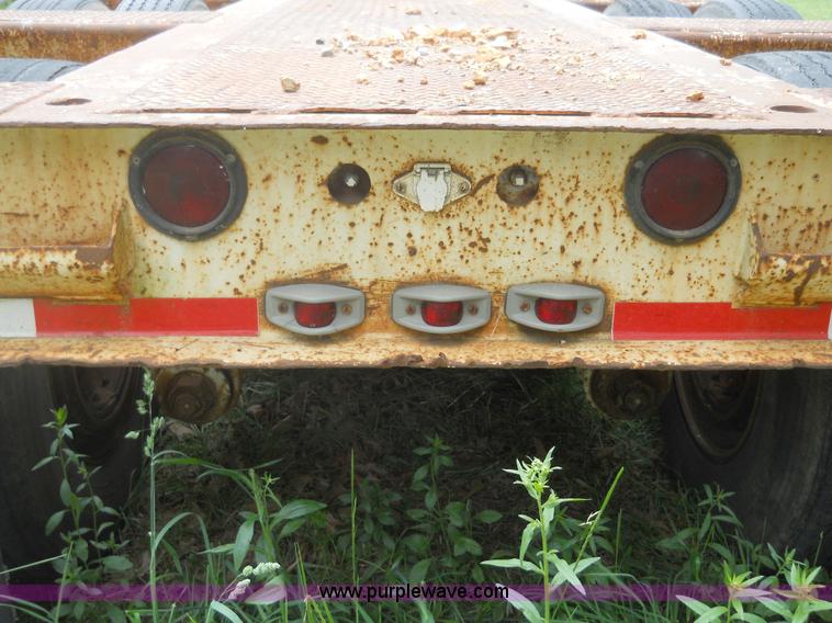 image for item 7872 1995 White GMC Aero WIA semi truck with triple axle trailer