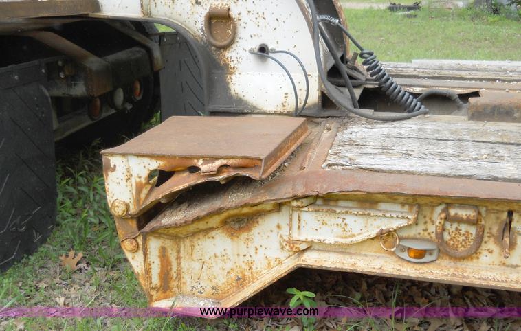 image for item 7872 1995 White GMC Aero WIA semi truck with triple axle trailer