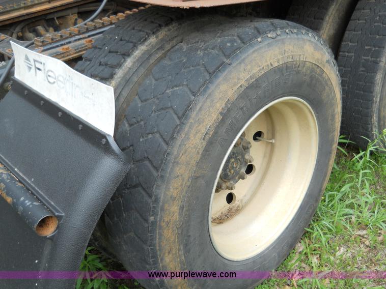 image for item 7872 1995 White GMC Aero WIA semi truck with triple axle trailer