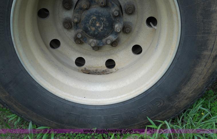 image for item 7872 1995 White GMC Aero WIA semi truck with triple axle trailer