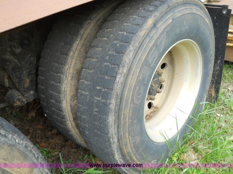 image for item 7872 1995 White GMC Aero WIA semi truck with triple axle trailer