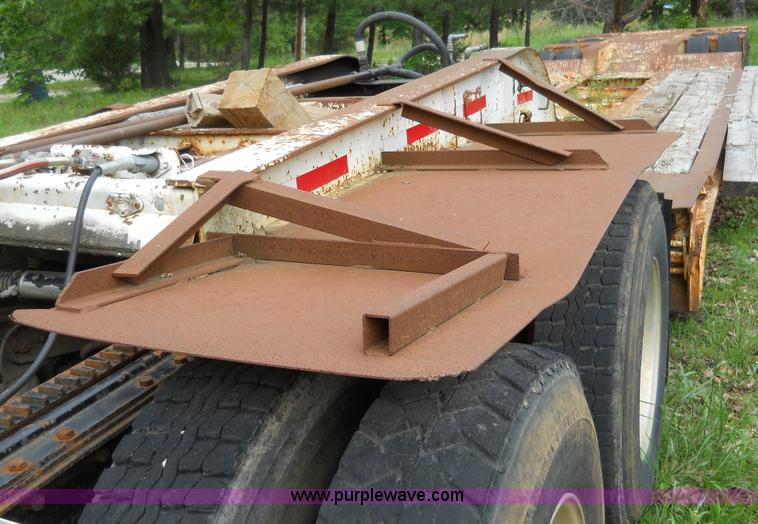 image for item 7872 1995 White GMC Aero WIA semi truck with triple axle trailer