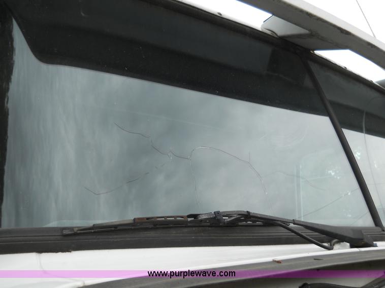 image for item 7872 1995 White GMC Aero WIA semi truck with triple axle trailer