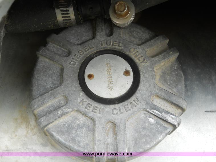 image for item 7872 1995 White GMC Aero WIA semi truck with triple axle trailer