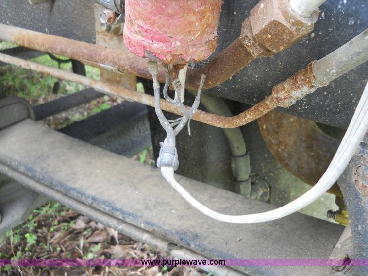 image for item 7872 1995 White GMC Aero WIA semi truck with triple axle trailer