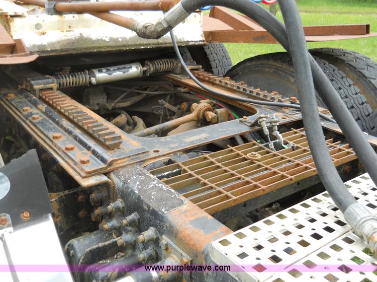 image for item 7872 1995 White GMC Aero WIA semi truck with triple axle trailer