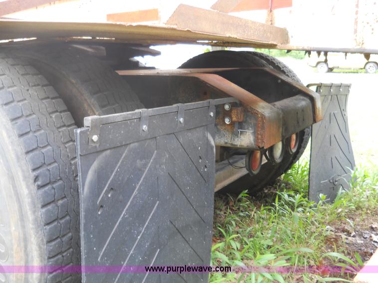 image for item 7872 1995 White GMC Aero WIA semi truck with triple axle trailer