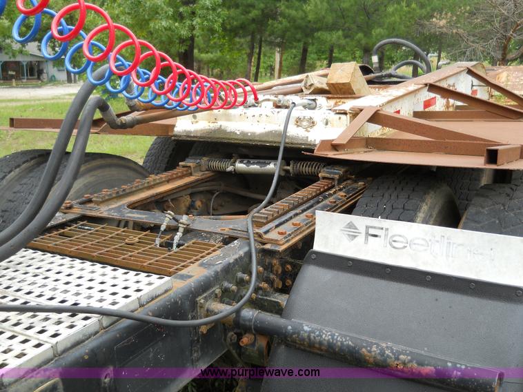 image for item 7872 1995 White GMC Aero WIA semi truck with triple axle trailer