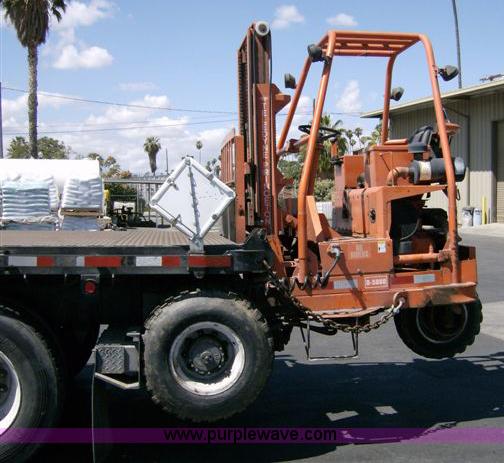 image for item 1001 1991 International 8300 flatbed semi truck with truck mounted forklift