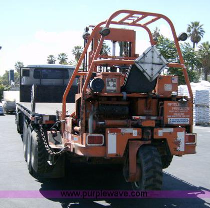 image for item 1001 1991 International 8300 flatbed semi truck with truck mounted forklift