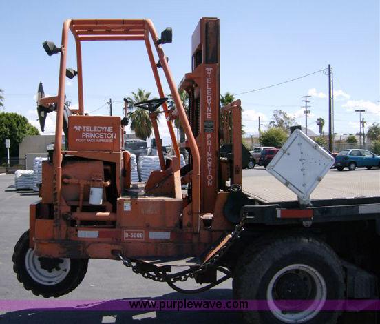image for item 1001 1991 International 8300 flatbed semi truck with truck mounted forklift