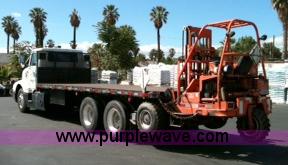 image for item 1001 1991 International 8300 flatbed semi truck with truck mounted forklift