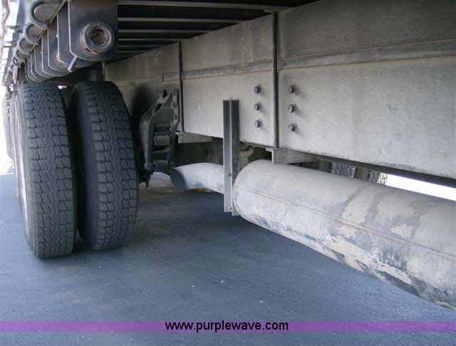 image for item 1001 1991 International 8300 flatbed semi truck with truck mounted forklift