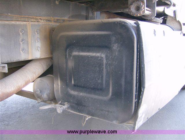 image for item 1001 1991 International 8300 flatbed semi truck with truck mounted forklift