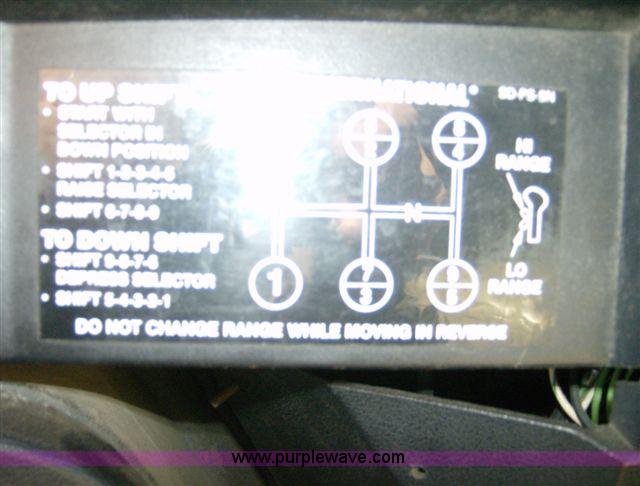 image for item 1001 1991 International 8300 flatbed semi truck with truck mounted forklift