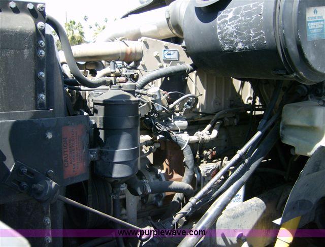 image for item 1001 1991 International 8300 flatbed semi truck with truck mounted forklift