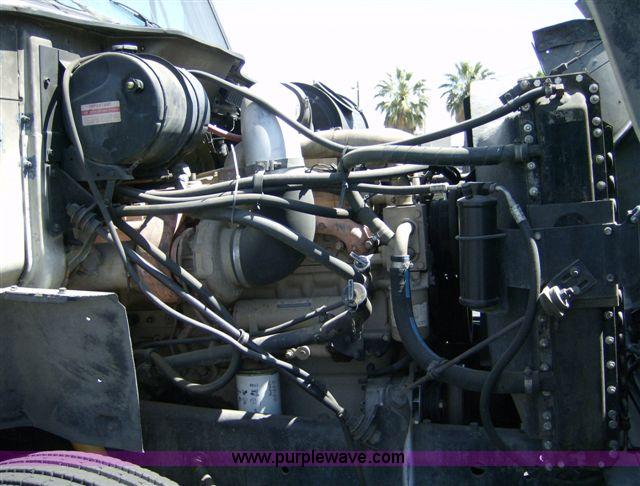 image for item 1001 1991 International 8300 flatbed semi truck with truck mounted forklift