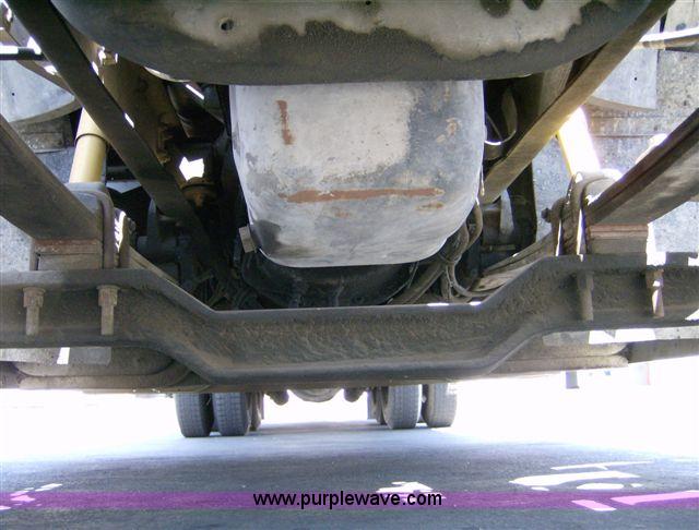 image for item 1001 1991 International 8300 flatbed semi truck with truck mounted forklift