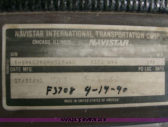 image for item 1001 1991 International 8300 flatbed semi truck with truck mounted forklift