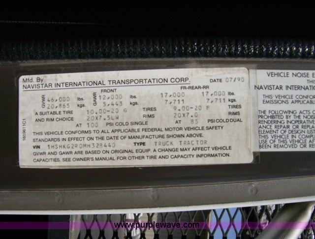 image for item 1001 1991 International 8300 flatbed semi truck with truck mounted forklift