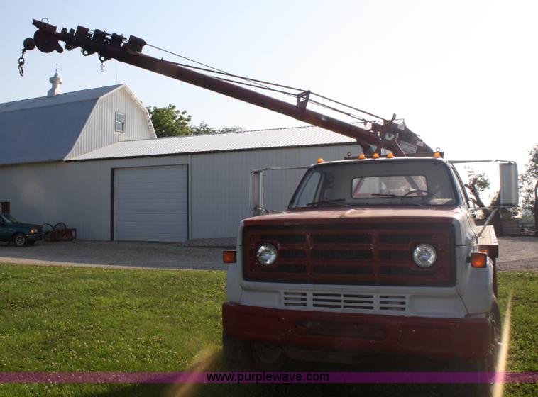 image for item 5085 1987 GMC 7000 flatbed truck with crane attachment