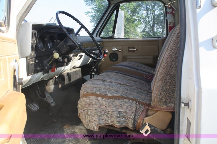 image for item 5085 1987 GMC 7000 flatbed truck with crane attachment