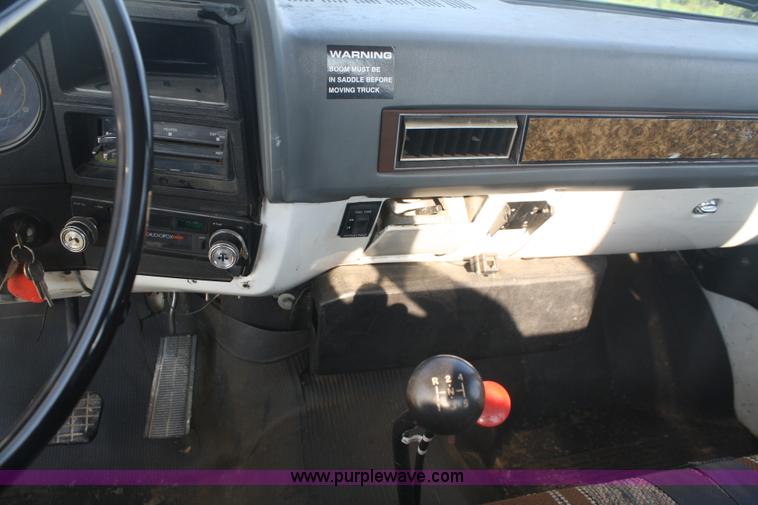 image for item 5085 1987 GMC 7000 flatbed truck with crane attachment