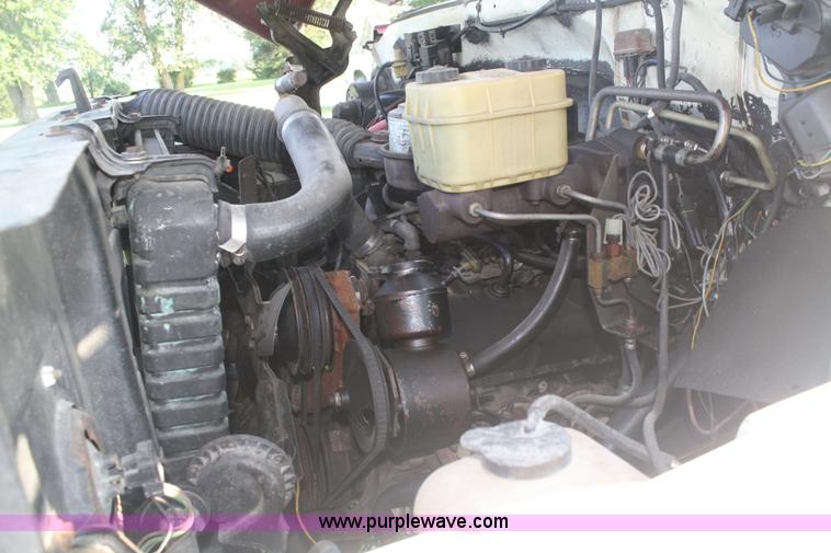 image for item 5085 1987 GMC 7000 flatbed truck with crane attachment