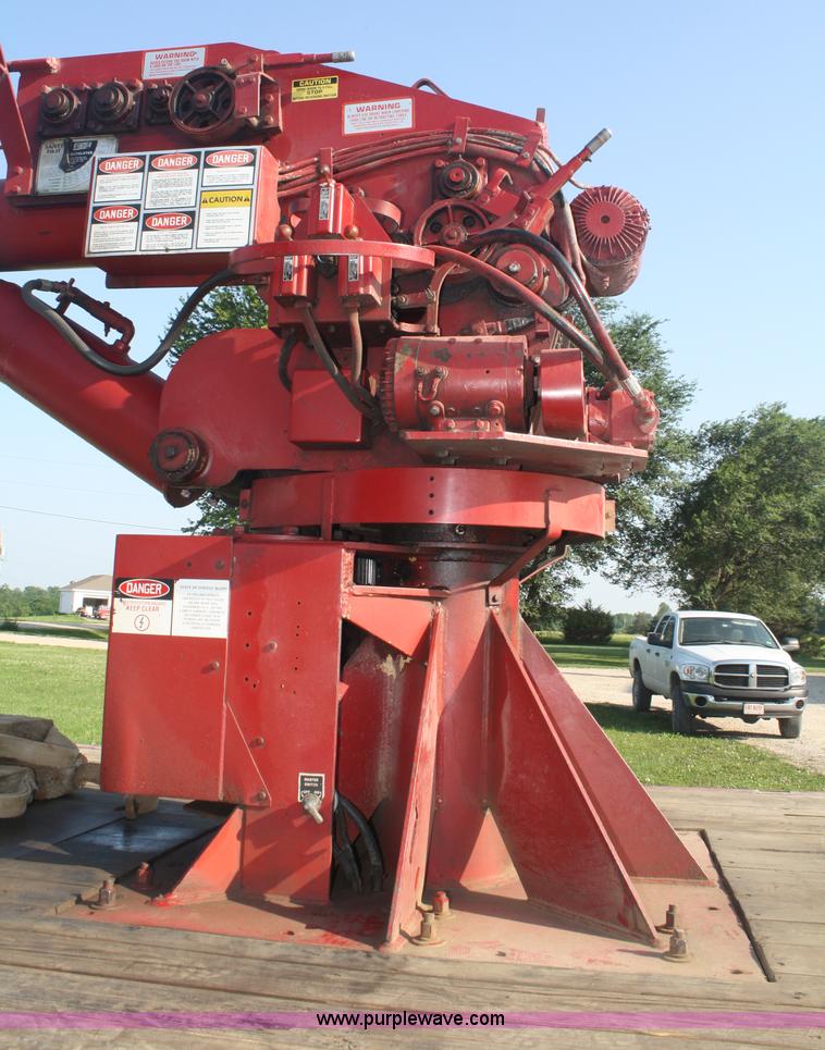 image for item 5085 1987 GMC 7000 flatbed truck with crane attachment