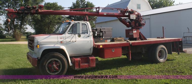 image for item 5085 1987 GMC 7000 flatbed truck with crane attachment