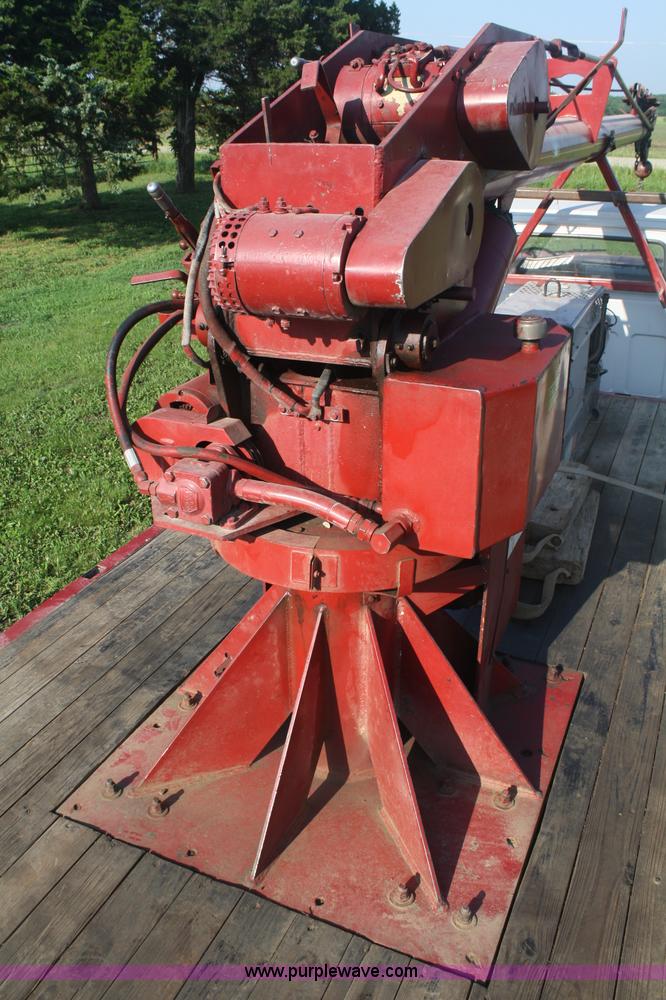 image for item 5085 1987 GMC 7000 flatbed truck with crane attachment