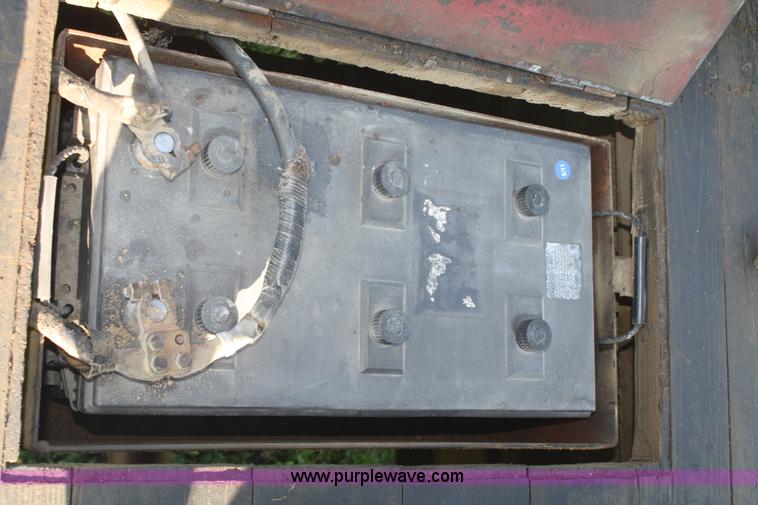 image for item 5085 1987 GMC 7000 flatbed truck with crane attachment