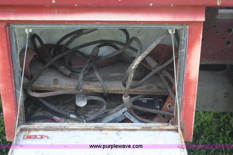 image for item 5085 1987 GMC 7000 flatbed truck with crane attachment