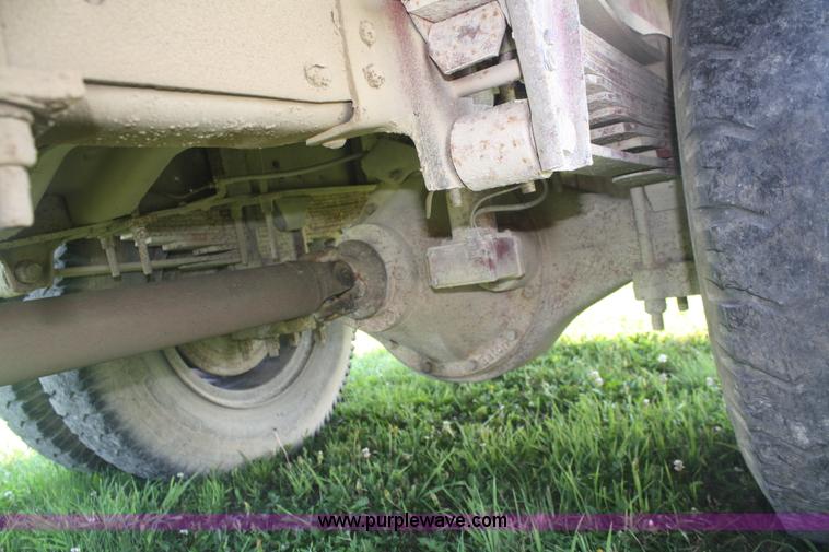 image for item 5085 1987 GMC 7000 flatbed truck with crane attachment