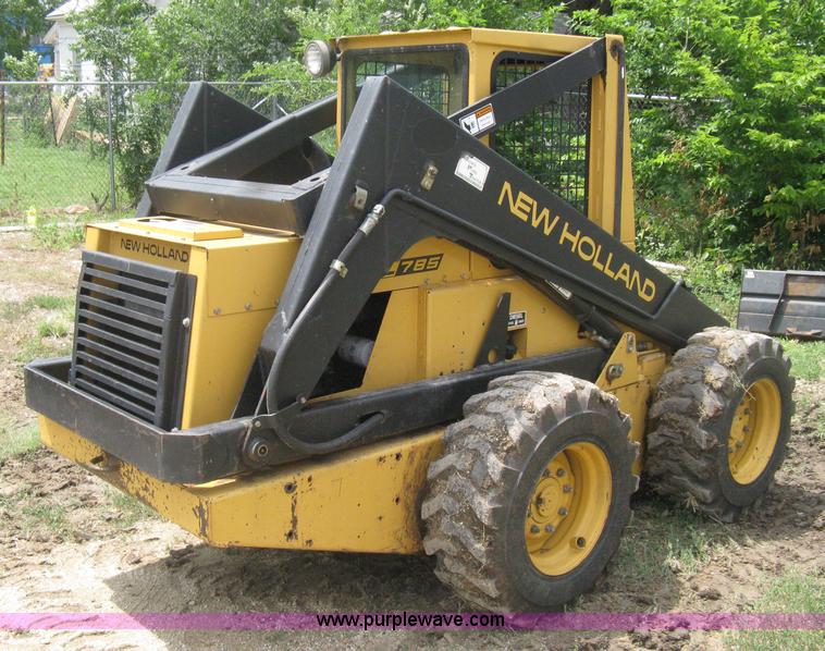 image for item 8002 New Holland L785 skid steer